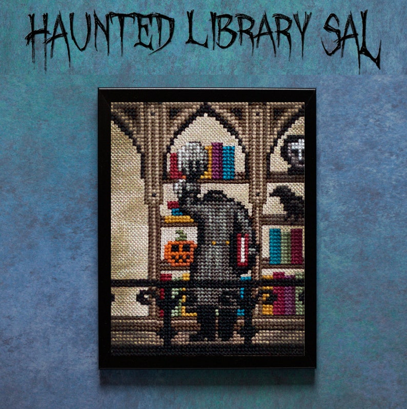 May include: A framed cross-stitch artwork depicting a spooky library scene with a figure in a gray coat standing in front of bookshelves. The shelves are filled with books and there is a pumpkin on the bottom shelf. The artwork is titled "Haunted Library Sale".