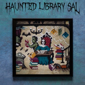 May include: A cross-stitch embroidery framed in black, depicting a woman in a blue dress sitting at a table with a book, a green figure standing behind her, and a spider on a stack of books. The scene is set in a library with a chandelier, bats, and cobwebs.