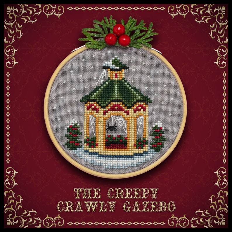 May include: A cross-stitch embroidery of a creepy crawley gazebo with a spider web and a spider inside. The gazebo is decorated with holly and snow. The embroidery is framed in a wooden hoop and has a red background with gold trim.