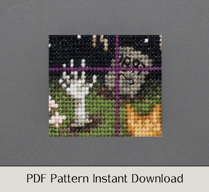 May include: A cross-stitch pattern featuring a spooky Halloween scene with a ghost, a graveyard, and a pumpkin. The pattern is in black, white, green, orange, and purple.