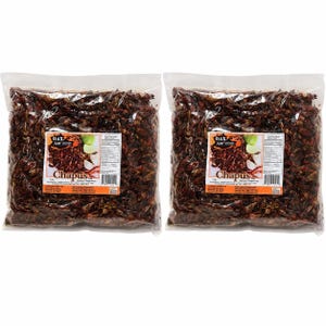 May include: Two clear plastic bags filled with dark brown toasted chapulines. Each bag features a white rectangular label with the text OAX. Chapus, a small image of the insects, and a nutrition facts panel. The label states a weight of 1 lb.
