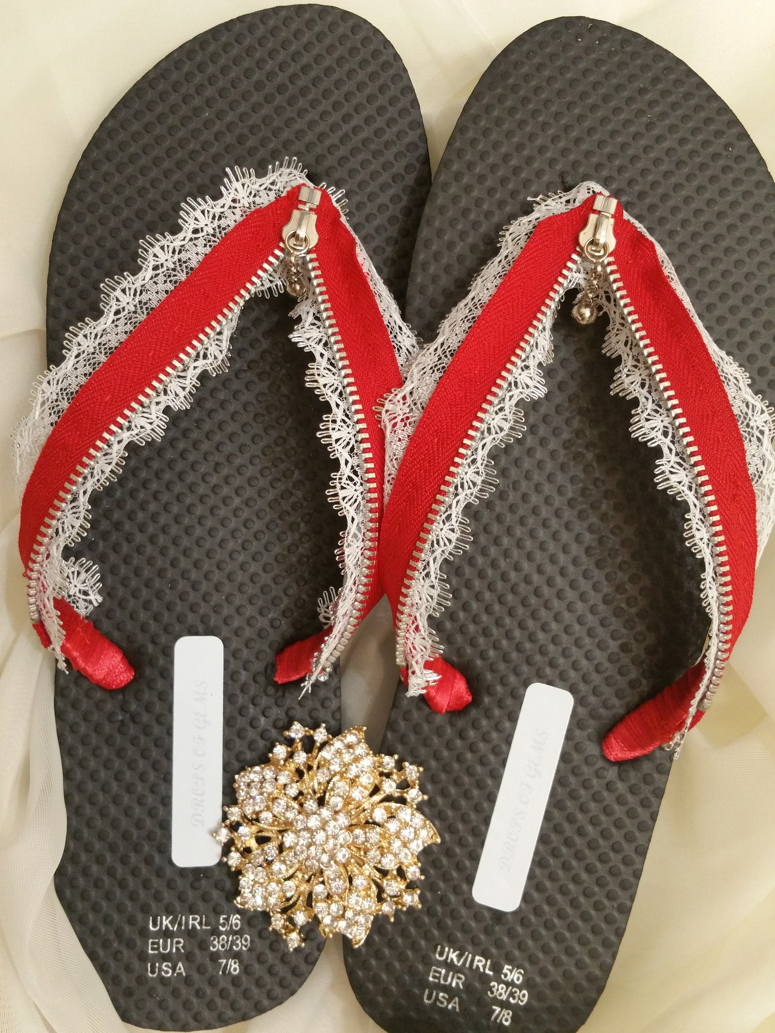 Decorated Flip Fops with Red Zipper and White Silver Rim Lace