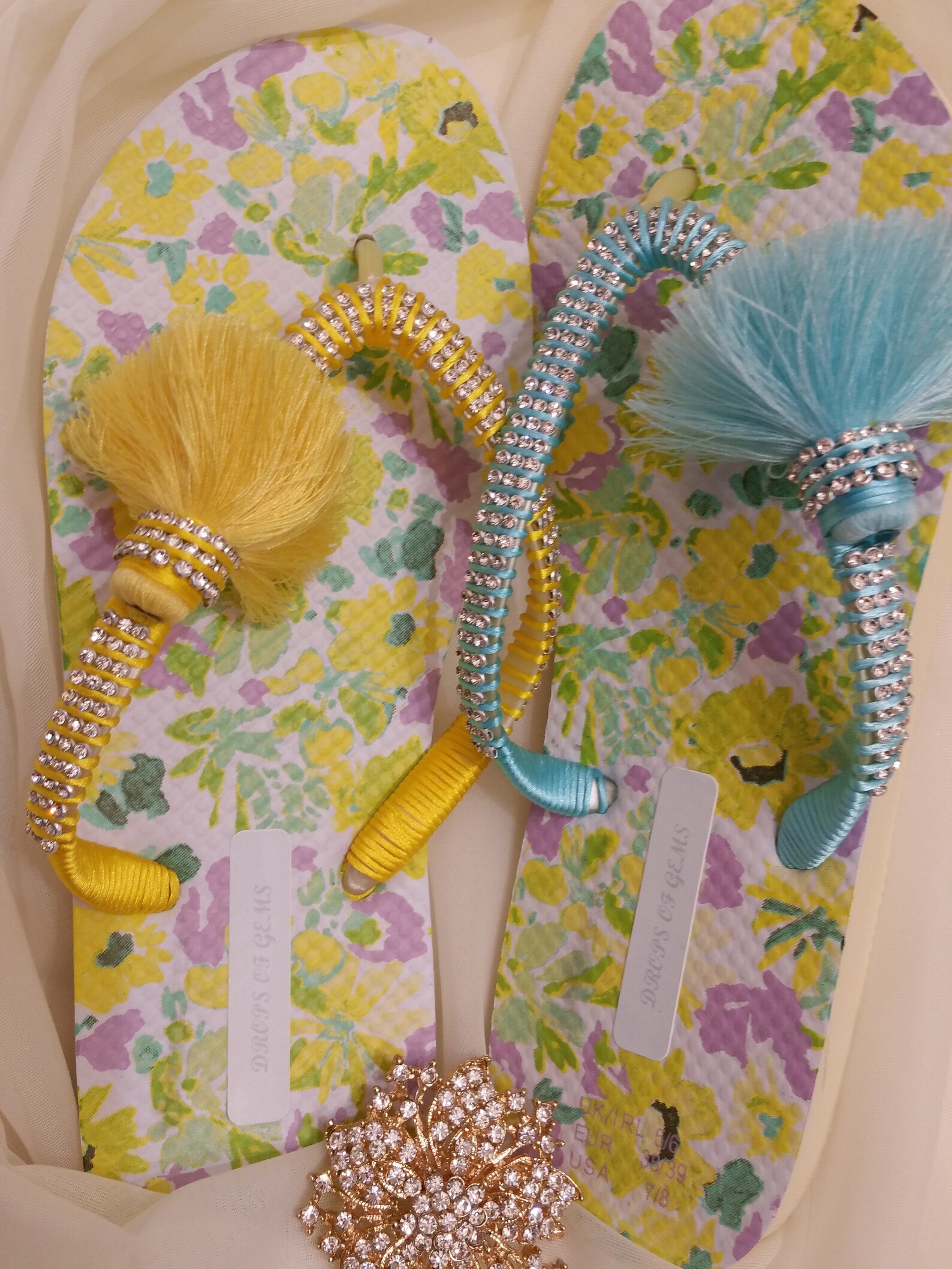Embellished Flip Flops with Mismatched Baby Blue and Light-Yellow Pompoms