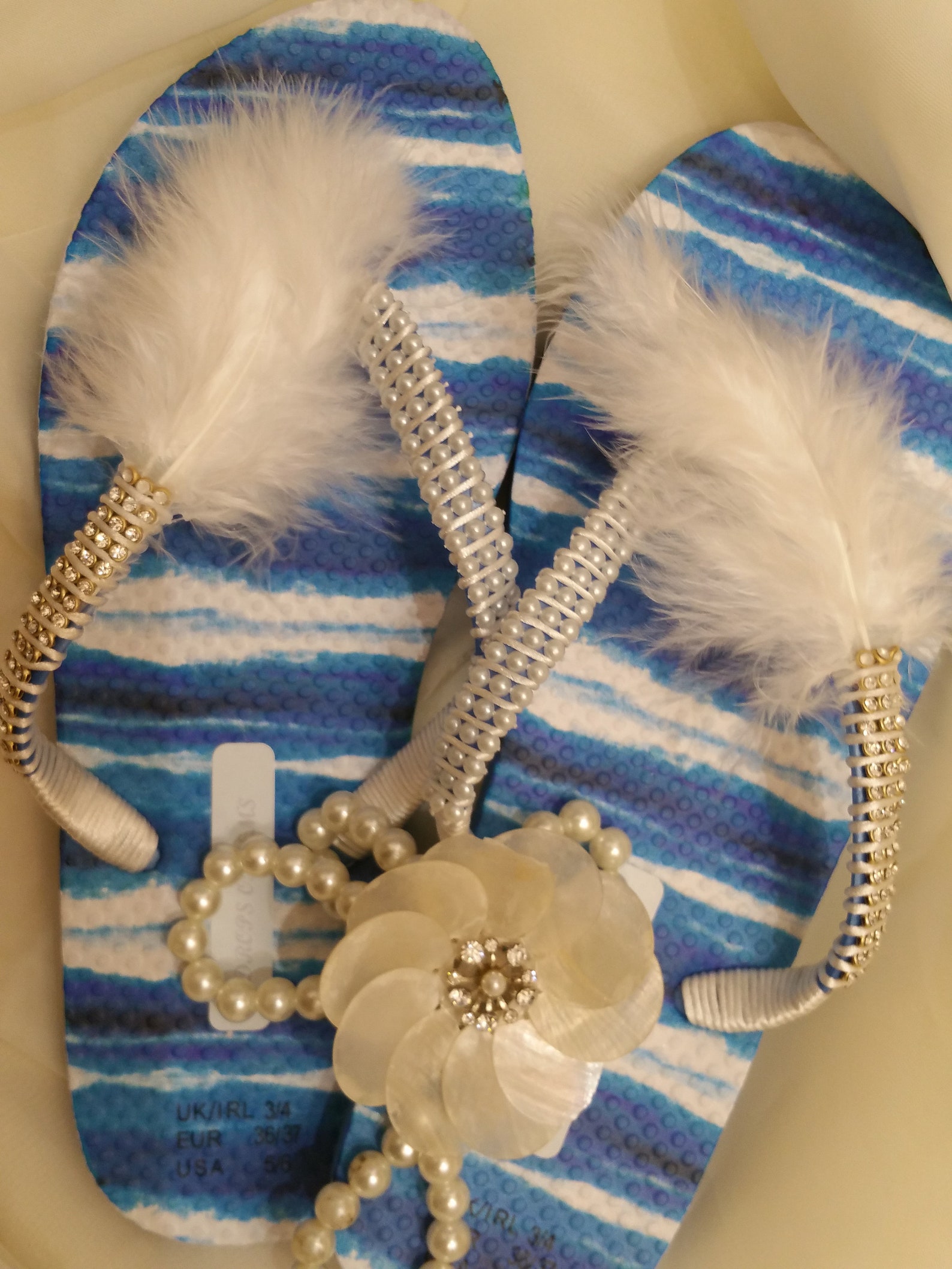 Embellished Flip Flops with Half White Pearls and White Feathers