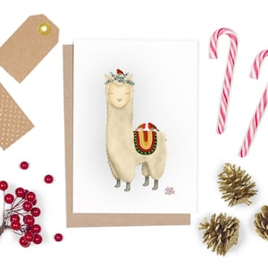 Llama festiva y petirrojo, tarjeta de saludos navideños extravagantes, diseño dibujado a mano por artista inglés independiente, tarjeta de semillas plantables de Navidad
