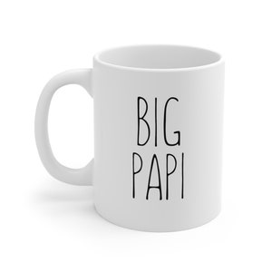 May include: White ceramic coffee mug with black text that reads "BIG PAPI".
