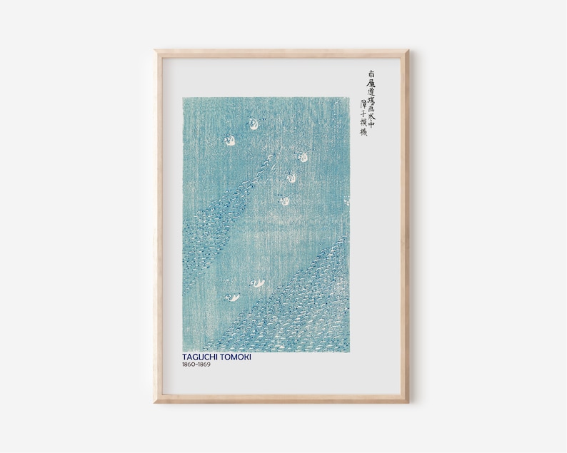 May include: A framed print of a blue and white Japanese woodblock print by Taguchi Tomoki (1950-1969). The print depicts a scene of water with white birds flying over it. The Japanese text in the upper right corner reads "石橋庵 十二景".