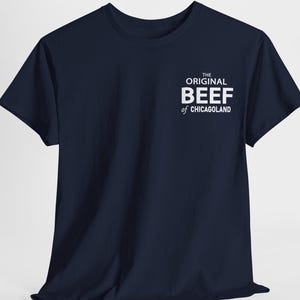 May include: A navy blue t-shirt with white text that reads "The Original Beef of Chicagoland".