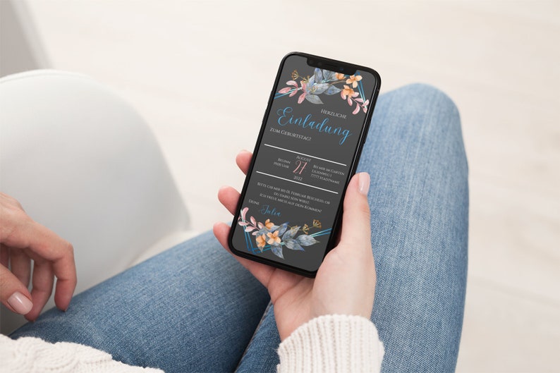 May include: A smartphone displaying a digital invitation with a floral design. The invitation reads "Herzliche Einladung zum Geburtstag!" with a date of August 27, 2022.