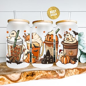 May include: Set of three white tumblers with lids and straws. Each tumbler features a different Halloween-themed beverage with a ghost, bats, and fall colors. The tumblers are perfect for fall and Halloween.