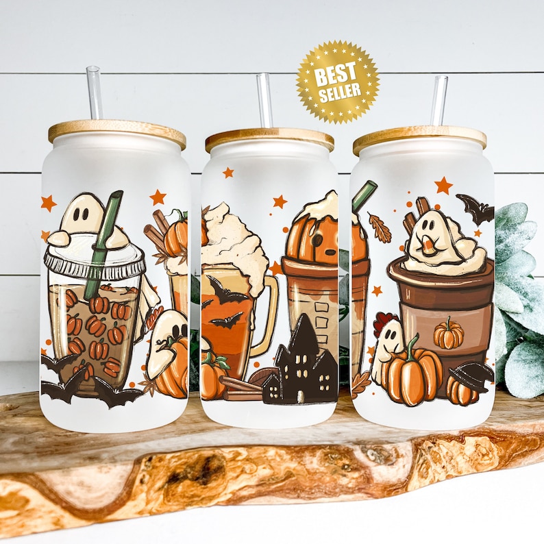 May include: Set of three white tumblers with lids and straws. Each tumbler features a different Halloween-themed beverage with a ghost, bats, and fall colors. The tumblers are perfect for fall and Halloween.