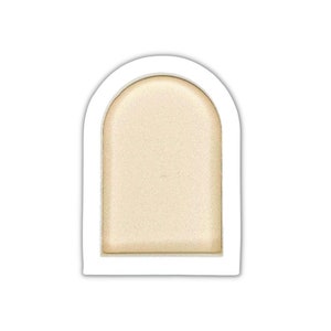 May include: A single, round, light beige eyeshadow pan in a white, arched plastic container.