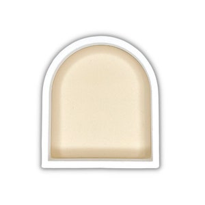 May include: White ceramic arch-shaped tray with a smooth, off-white interior. The tray is perfect for displaying small items or serving snacks.
