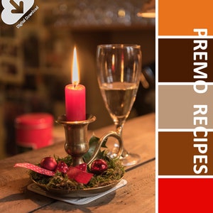 May include: A lit red candle in a brass holder with festive decorations, including red baubles and ribbon. A wine glass stands beside the candle. The image includes the text "PREMO RECIPES" and "Digital Download".
