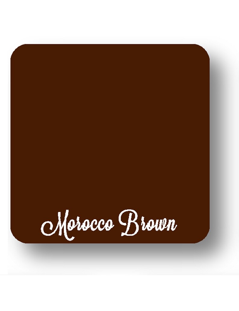 May include: A square, dark brown object with rounded corners. The words "Morocco Brown" are written in a cursive font across the bottom of the object. The background is white.