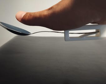 Snap-on fork and spoon holder for people with disabilities