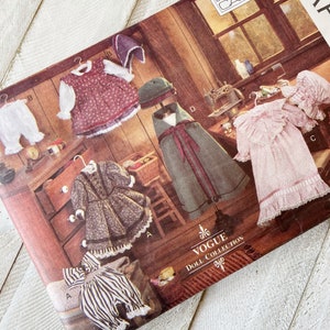 May include: A vintage Vogue Doll Collection sewing pattern featuring five different doll outfits. The pattern is designed by Linda Carr and includes a dress, cape, bonnet, and pants.