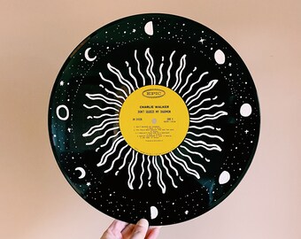 Sun and wave painted on record
