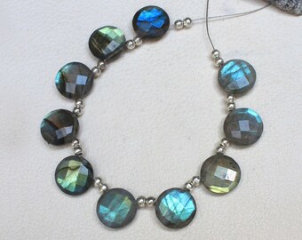 May include: A strand of round, faceted labradorite beads in shades of blue, green, and gray, strung on a silver chain.