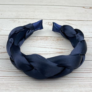 Add a pop of color to your look with this navy blue headband