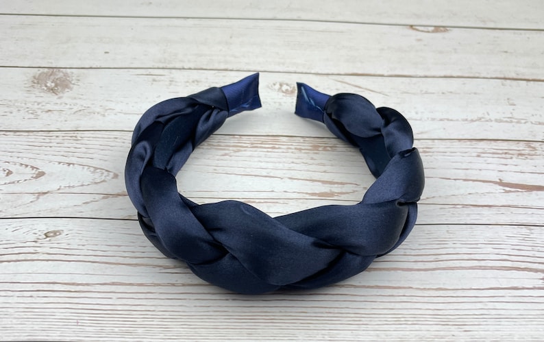 Add a pop of color to your look with this navy blue headband