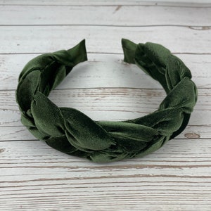 Elevate your look with this trendy knotted headband in army green, perfect for any fashion-forward woman.
