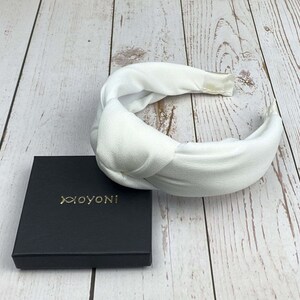Luxurious snow-white padded headband for weddings and special celebrations.