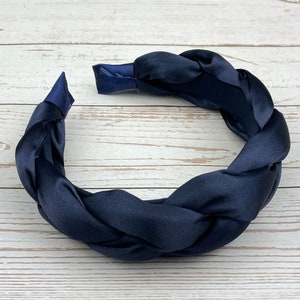 Elevate your hairstyle with this knotted navy blue headband