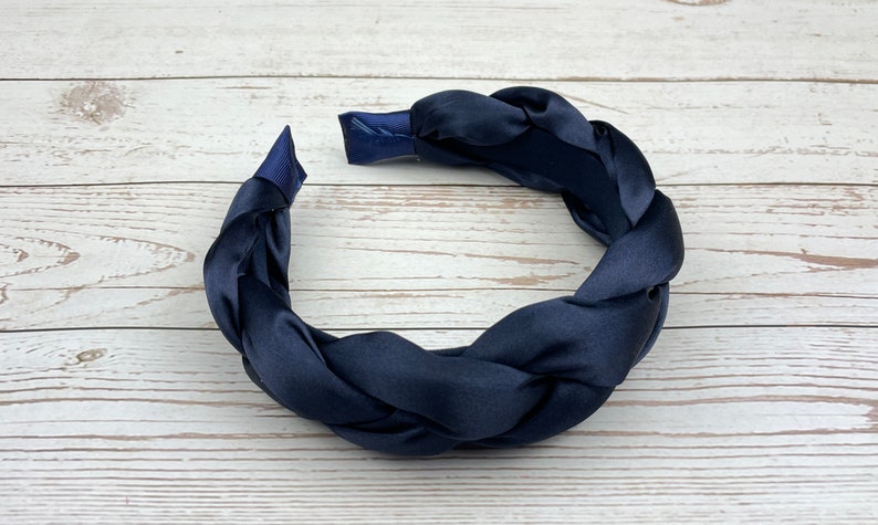 Elevate your hairstyle with this knotted navy blue headband