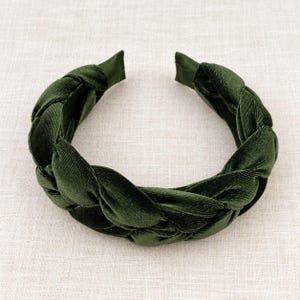 Dark olive green velvet braided headband for women, featuring a wide padded plaited design and soft textured fabric.