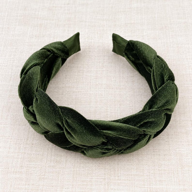 Dark olive green velvet braided headband for women, featuring a wide padded plaited design and soft textured fabric.