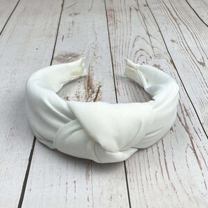 Add a touch of sophistication to your look with this snow-white padded headband.