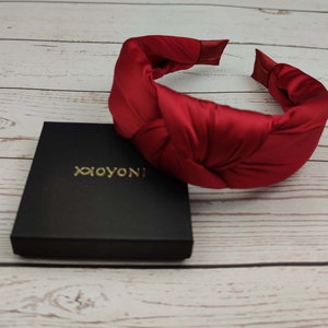 Treat her to a luxurious head accessory this birthday with this beautifully designed red satin headband.