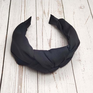 Give your look an extra boost with this fashionable Black Headband. It is made from high-quality materials and will keep your hair looking sleek and stylish all day long.