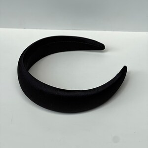 Make a statement with these dark and elegant black satin headbands, perfect for women of all ages.