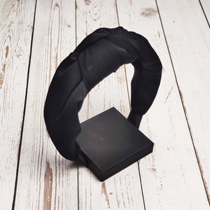 Get that polished look for special events or weddings with a black twist knot headband! Made from soft, luxurious materials, they will keep your hair styled and looking perfect all evening long.