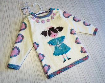 Girl’s size 4, quirky, unique, white, merino wool, hand knit jumper with embroidered design.