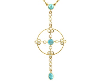 May include: A gold necklace with a pendant featuring a cross design with blue gemstones and white pearls. The pendant is surrounded by a circle and the necklace is adorned with pearls.