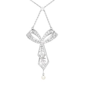 1.29ct Diamond and Pearl, Platinum Bow Pendant - Antique Circa 1900