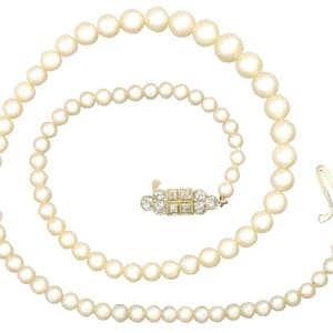 Antique and Vintage Single Strand Pearl Necklace with 0.56 ct Diamond and 15k Yellow Gold Clasp