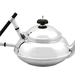 May include: A silver teapot with a black wooden handle and knob. The teapot has a round body and a spout on the right side. The teapot is polished and shiny.