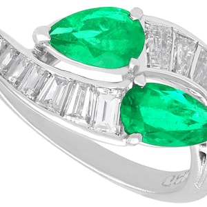 Antique Art Deco Twist Ring with 0.90 Carat Colombian Emerald and 1.20 Carat Diamond in Platinum Circa 1920