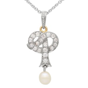 Colgante de oro amarillo de 14 quilates con perla antigua y diamante de 0,49 ct, circa 1900