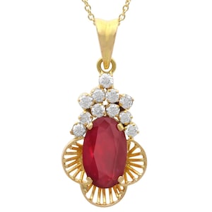 Vintage 2.53 Carat Ruby Pendant with 0.48 Carat Diamond in 18k Yellow Gold Circa 1980