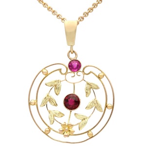 Antique 0.48ct Garnet Pendant with Amethyst in 9k Yellow Gold