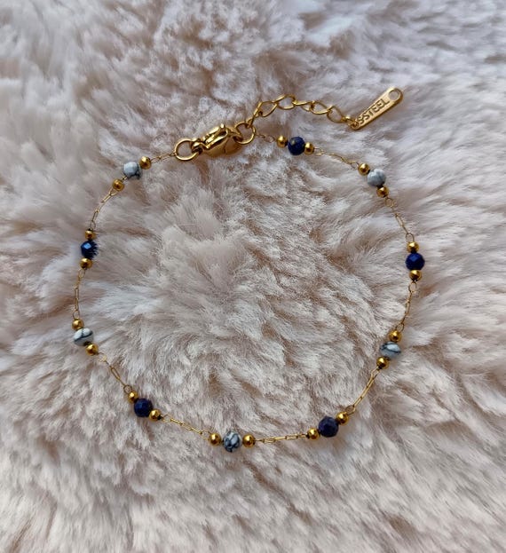 Gold-tone stainless steel chain bracelet (304L) with enameled beads, midnight blue, marbled white, and gold resin accents. Handcrafted.