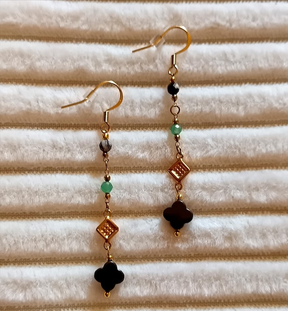 Gold-tone stainless steel drop earrings with marbled green and black gold beads, handcrafted.
