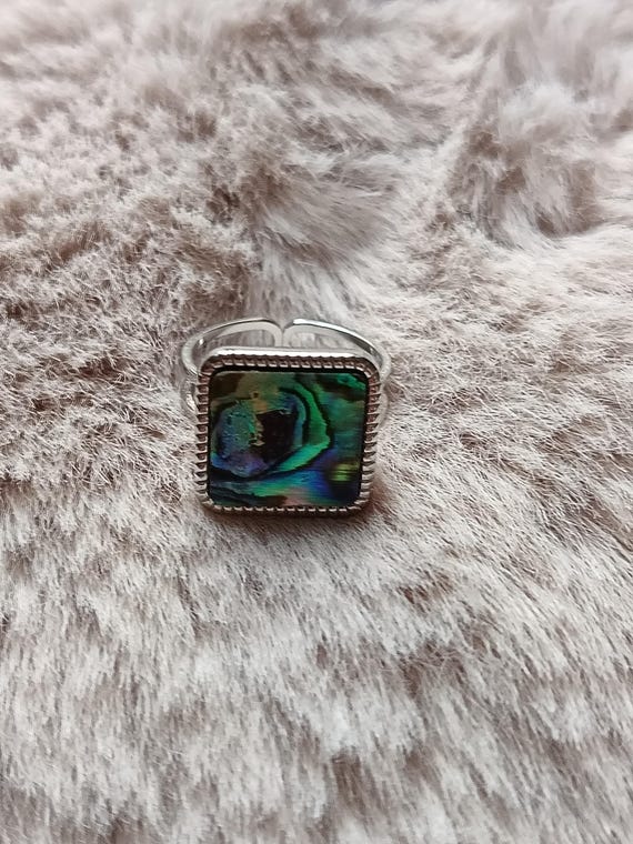Adjustable square ring in 304l stainless steel with a pearly green, blue, and pink veiled inlay.