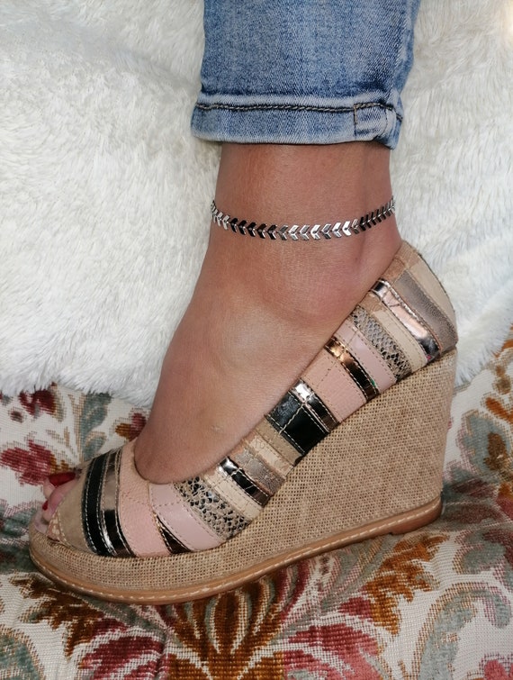 Silver-tone stainless steel anklet with herringbone links, handcrafted.