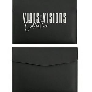 May include: Two black document holders. The top one has the text "VIBES AND VISIONS Collective" in white. The bottom document holder is plain black with a flap closure. The document holders are made of a smooth material.